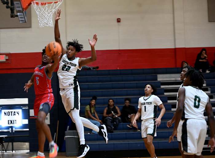 Kiori Jordan-Thomas from Rockledge drives under the basket while Olivan Owens from Albany Green Tech defends during the fifth-place game at the Kingdom in the Sun Tournament at Vanguard High School in Ocala.